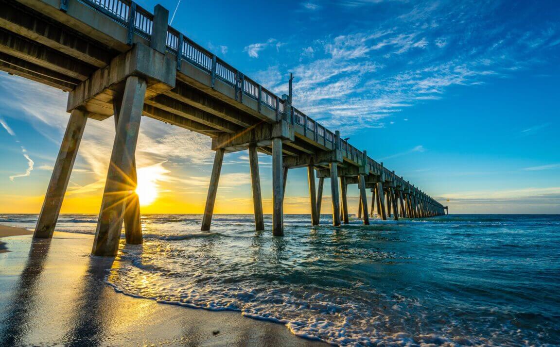 A close up of a pier next to a body of water